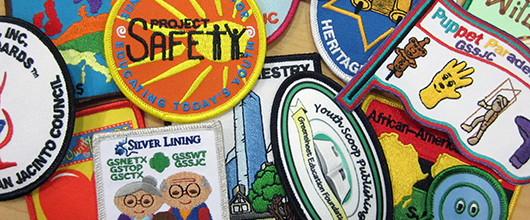 Girl Scout council patches displayed in a collage