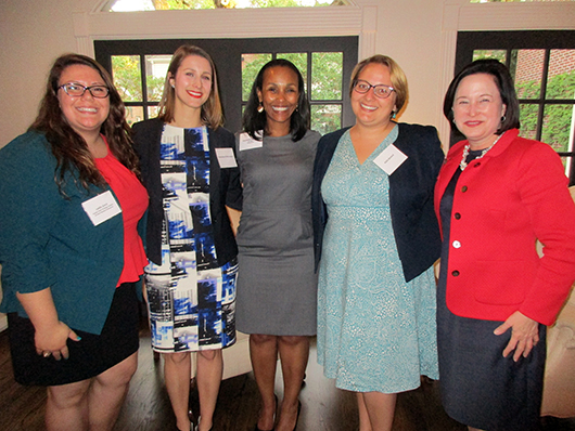 Girl Scout alumnae association members posed for a group photo at an event